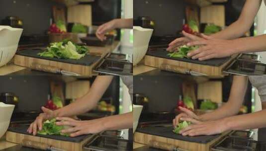 女性手在沙拉碗里放生菜的特写高清在线视频素材下载