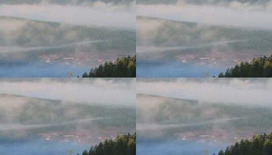 山坳里晨雾中的山村高清在线视频素材下载