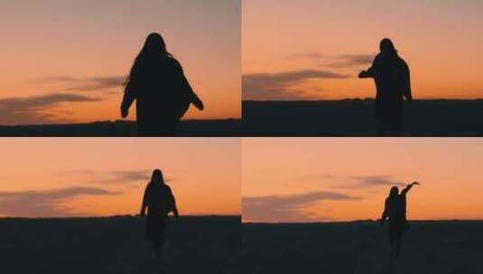 黄昏夕阳下西北戈壁滩行走的少女背影高清在线视频素材下载