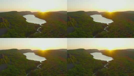 日出时公园云湖上空的空中高清在线视频素材下载
