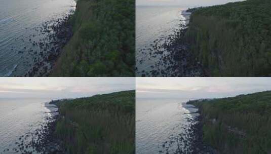 航拍傍晚的北海涠洲岛海边山崖美丽风景高清在线视频素材下载