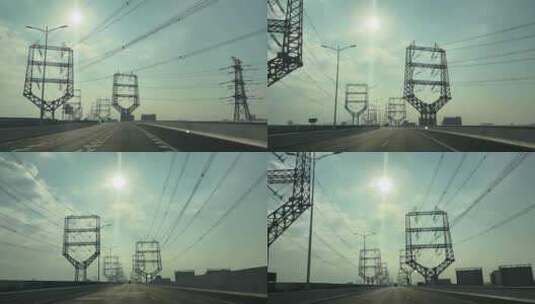 道路两侧的高压线公路电塔中国电力电网铁塔高清在线视频素材下载