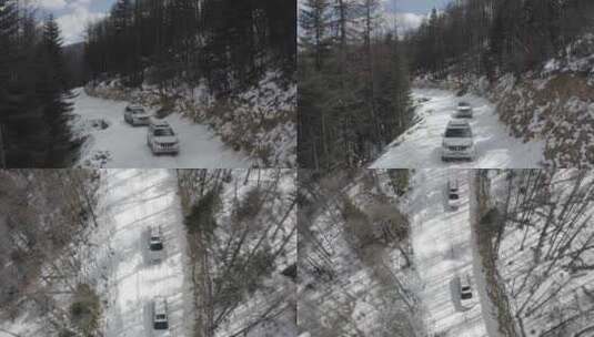 越野车在下雪的山区丛林冰雪路面运输航拍4k高清在线视频素材下载
