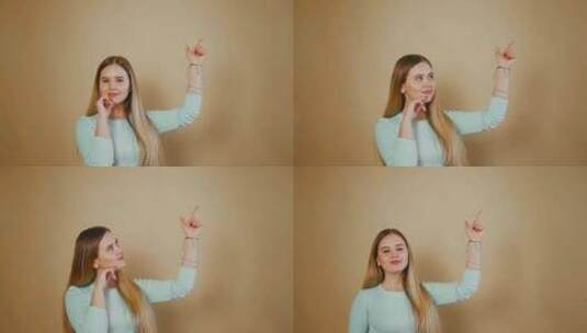 年轻女子竖起手指年轻快乐女孩的肖像，展示高清在线视频素材下载