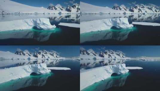 南极洲巨大的高耸冰山漂浮在海洋上高清在线视频素材下载