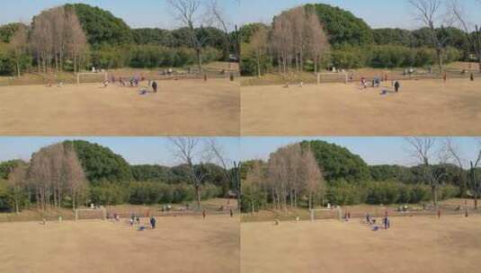 航拍公园踢球的孩子高清在线视频素材下载