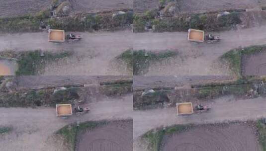 农民开拖拉机在乡间小道运输玉米高清在线视频素材下载