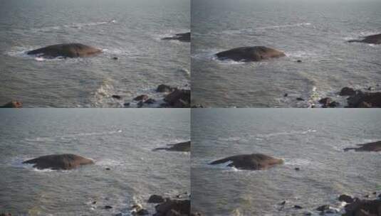 浑浊海水礁石风吹海面高清在线视频素材下载