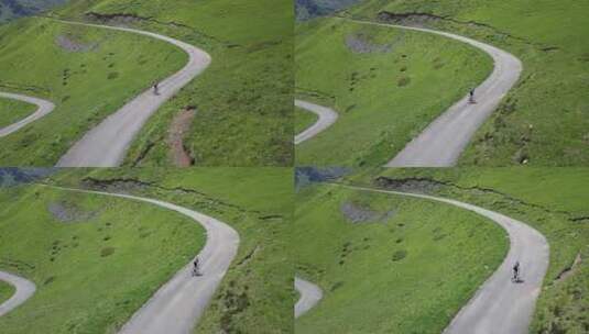 一男子骑自行车行驶在山间的公路上高清在线视频素材下载