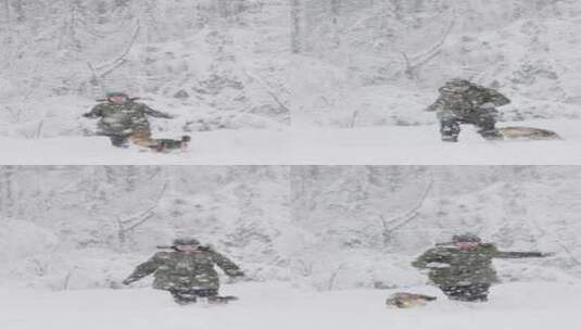 女人在雪地里和小狗玩耍高清在线视频素材下载