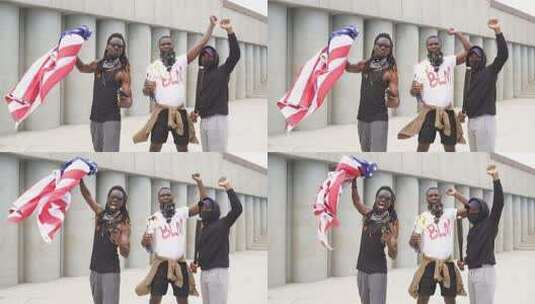 一群在街上举着美国国旗抗议的年轻非裔美国人。高清在线视频素材下载