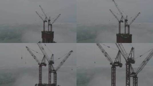 航拍武汉武昌江滩绿地顶楼起吊机云海高清在线视频素材下载