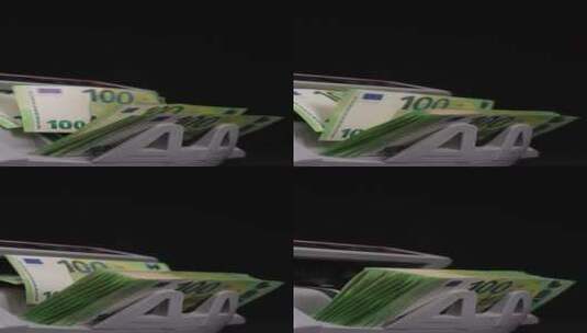 用点钞机数欧元纸币，垂直视频15高清在线视频素材下载