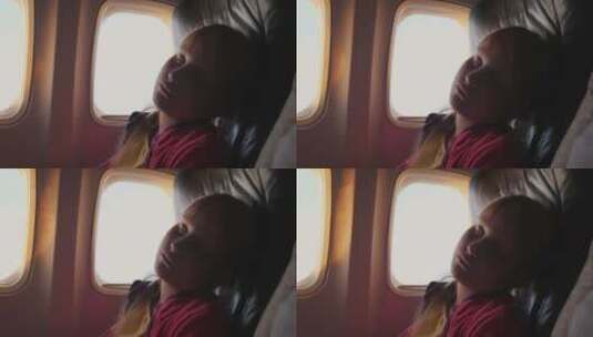 小女孩睡在飞机的客舱里高清在线视频素材下载