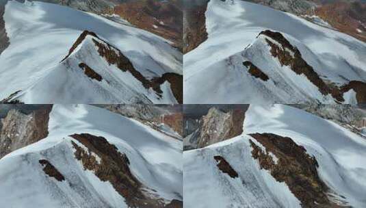 航拍攀登沙鲁里山脉尼登贡嘎雪山的登山者高清在线视频素材下载