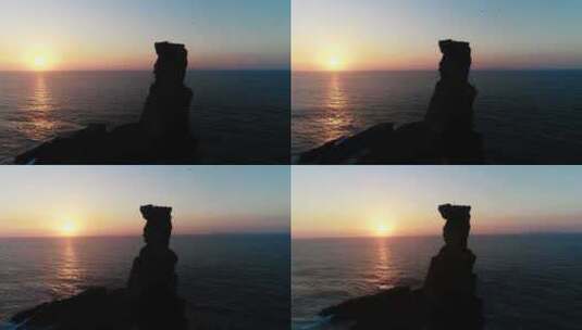 日落时海中岩石的形成高清在线视频素材下载