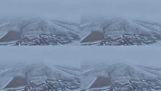 航拍风雪交加的山村高清在线视频素材下载