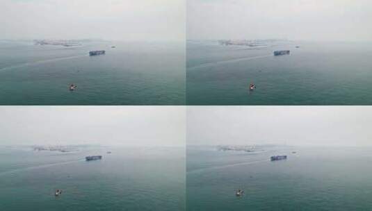 中国 山东青岛远洋货轮在大海上航行高清在线视频素材下载