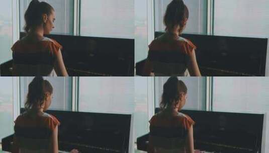 靠近窗户弹钢琴的女人高清在线视频素材下载