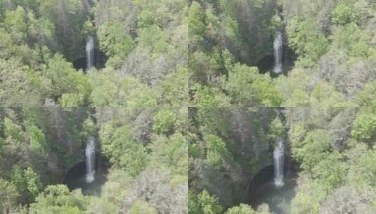航拍峡谷中的瀑布高清在线视频素材下载