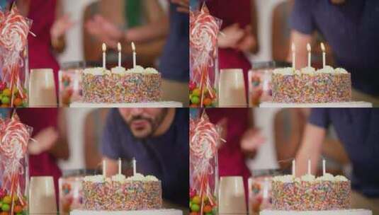一个过生日的人吹灭了蛋糕上的蜡烛高清在线视频素材下载