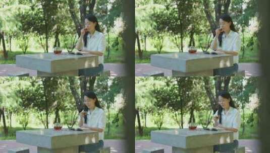 中国女性女人户外公园喝茶读书学习办公高清在线视频素材下载