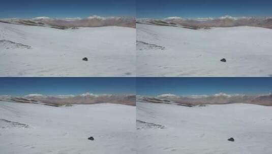 suv汽车越野行驶在一望无际的高山雪原高清在线视频素材下载