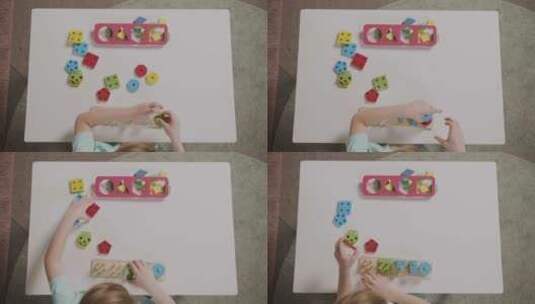 小女孩玩形状堆叠的积木高清在线视频素材下载