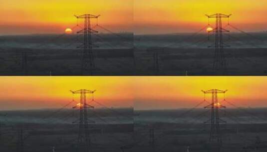 航拍夕阳下的高压输电塔高清在线视频素材下载