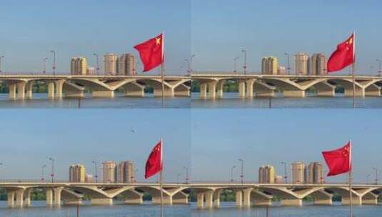 午后城市河流桥梁车流五星红旗高清在线视频素材下载