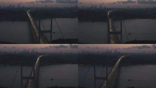 伊斯坦布尔7月15日烈士博斯普鲁斯桥在黄昏或夜晚与城市天际线剪影和汽车高清在线视频素材下载