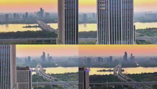 航拍夕阳高铁行驶桥梁河流车流建筑群高楼高清在线视频素材下载