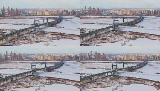 中国黑龙江哈尔滨阳明滩大桥雪景航拍高清在线视频素材下载