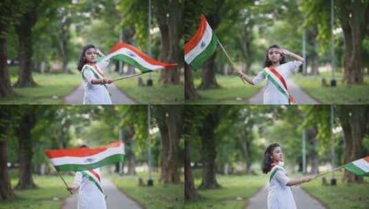 一个可爱的印度小女孩挥舞着三色f庆祝印度高清在线视频素材下载