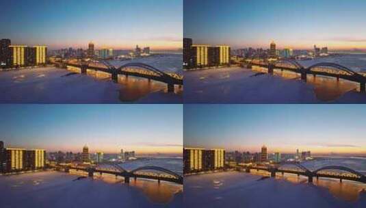中国黑龙江哈尔滨松花江滨洲铁路桥夜景航拍高清在线视频素材下载