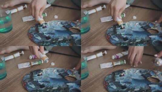 一个在调色板上画画的人高清在线视频素材下载