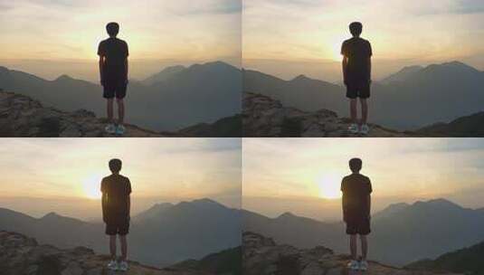 男子山顶赏日出远景高清在线视频素材下载