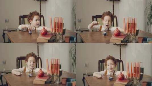 小男孩餐桌前玩玩具高清在线视频素材下载