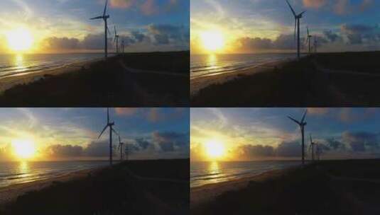 海岸线风力发电机组夕阳晚霞霞光映照海水1高清在线视频素材下载