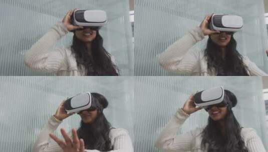 女人戴着AR眼镜体验虚拟世界高清在线视频素材下载