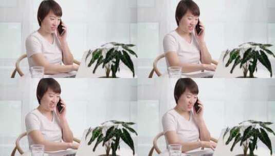 在家办公使用移动电话的亚洲女性高清在线视频素材下载
