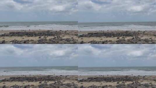 海浪拍打沙滩礁石高清在线视频素材下载