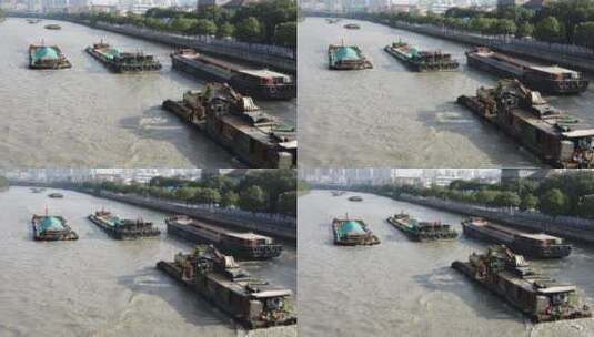 航拍高空俯瞰京杭运河上的货船高清在线视频素材下载