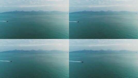 航拍深圳港附近海面一艘快艇飞速驶过高清在线视频素材下载