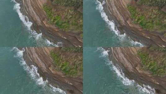 航拍涠洲岛海边悬崖峭壁浪花拍打山崖高清在线视频素材下载