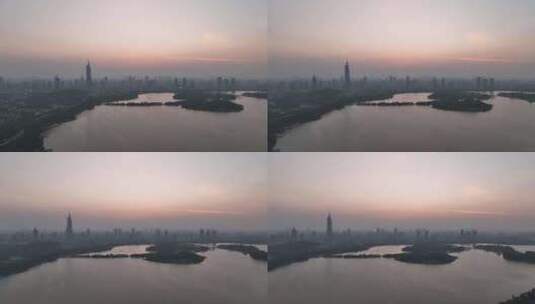 日落时分的江苏南京紫峰大厦玄武湖航拍高清在线视频素材下载