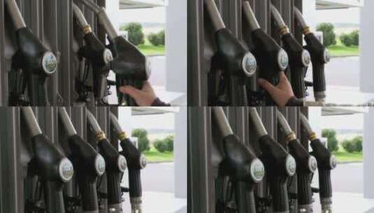 女子在加油站加油站使用燃料喷嘴高清在线视频素材下载