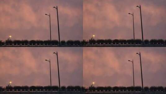晚霞火烧云的傍晚，立交桥上路灯点亮高清在线视频素材下载