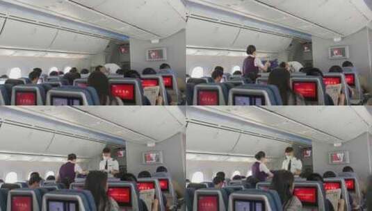 飞机客舱乘务员给乘客发放食物高清在线视频素材下载