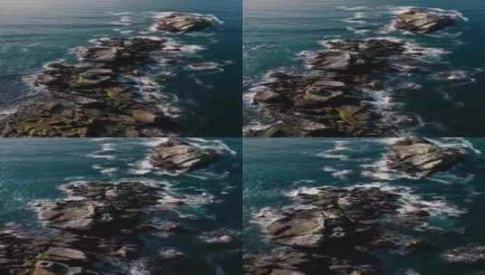 4k航拍海边礁石蓝色海浪拍打礁石高清在线视频素材下载